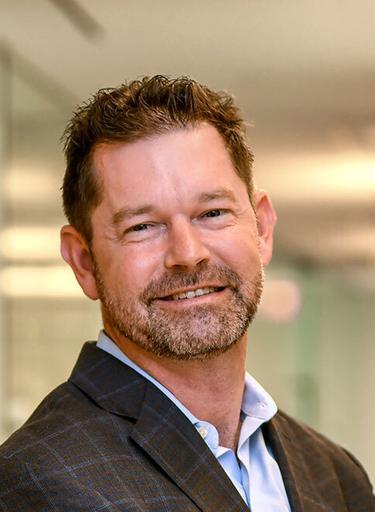 Portrait of Scott E. Smith, leadership advisor at Russell Reynolds Associates
