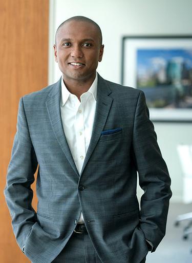 Portrait of Evan C. Sharp, leadership advisor at Russell Reynolds Associates