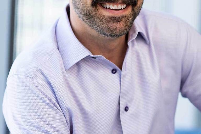 Portrait of Norm Yustin, leadership advisor at Russell Reynolds Associates