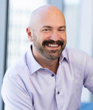 Portrait of Norm Yustin, leadership advisor at Russell Reynolds Associates