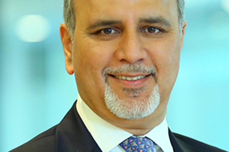 Portrait of Sanjay Kapoor, leadership advisor at Russell Reynolds Associates