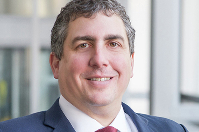 Portrait of Alain Ishak, leadership advisor at Russell Reynolds Associates