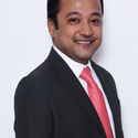 Portrait of Dhruv Shah, leadership advisor at Russell Reynolds Associates