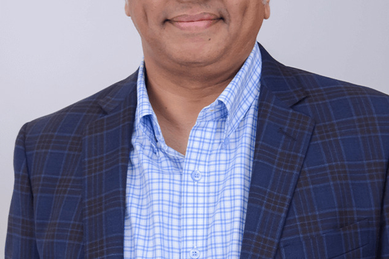 Portrait of Sachin Rajan, leadership advisor at Russell Reynolds Associates
