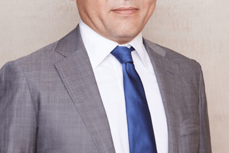 Portrait of Ryosuke Takai, leadership advisor at Russell Reynolds Associates