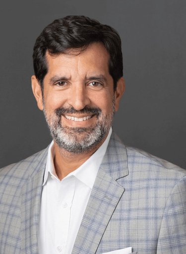 Portrait of Marc Baca, leadership advisor at Russell Reynolds Associates