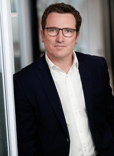 Portrait of Andrew White, leadership advisor at Russell Reynolds Associates