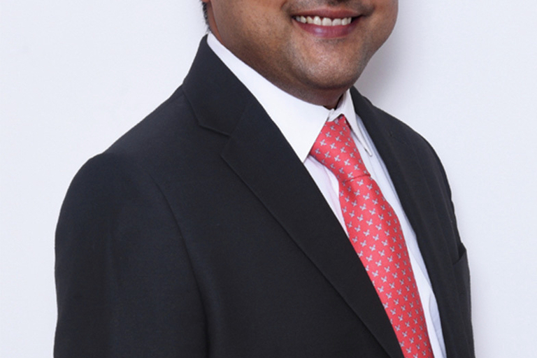 Portrait of Dhruv Shah, leadership advisor at Russell Reynolds Associates