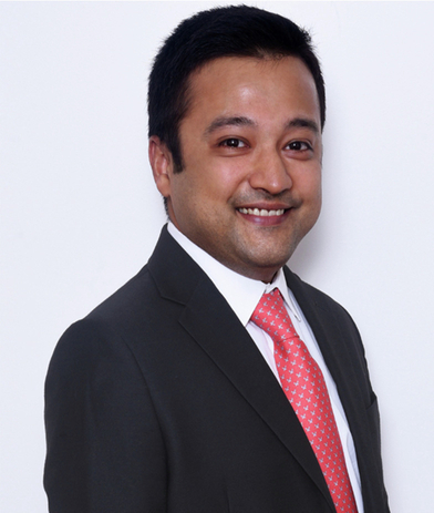 Portrait of Dhruv Shah, leadership advisor at Russell Reynolds Associates