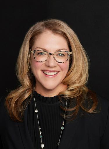 Portrait of Jina Abells Morissette, leadership advisor at Russell Reynolds Associates