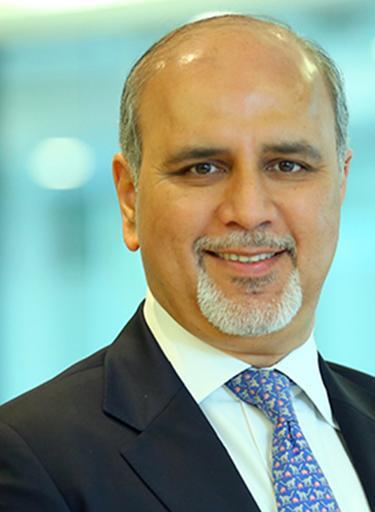 Portrait of Sanjay Kapoor, leadership advisor at Russell Reynolds Associates