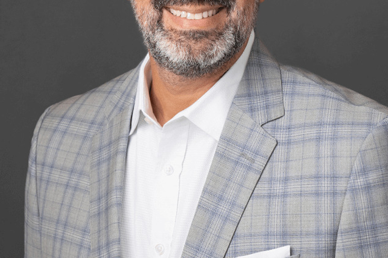 Portrait of Marc Baca, leadership advisor at Russell Reynolds Associates